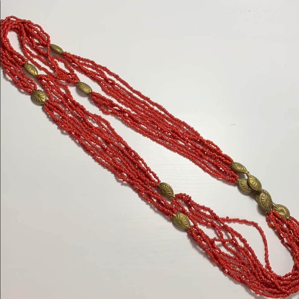 Long red and gold beaded necklace